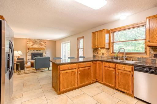 The oversized breakfast bar provides the perfect gathering place for casual meals, conversation, and entertaining.
