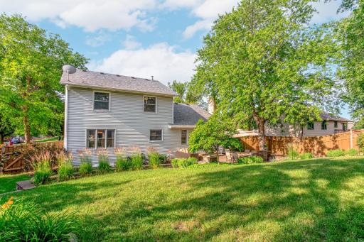 A generous, park-like backyard provides plenty of room to play, garden, or simply enjoy the peaceful surroundings.