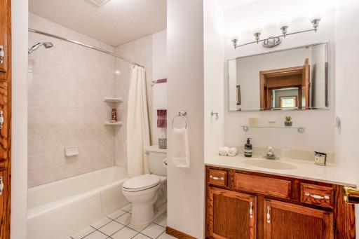The full bathroom features a spacious vanity and a tub/shower combination, providing comfort and convenience for everyday living.