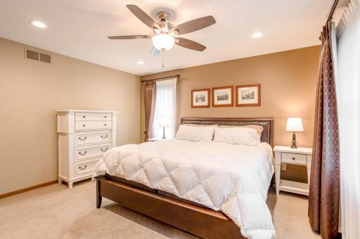 Enjoy comfort and space in the inviting primary bedroom, featuring generous natural light and a calming atmosphere.