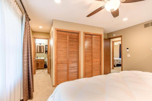 The primary suite includes dual closets and direct access to a private en suite bath.