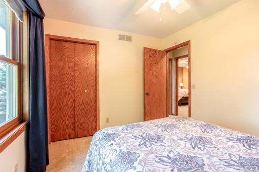 Offering a spacious closet and beautiful backyard views, this third bedroom is a restful retreat.