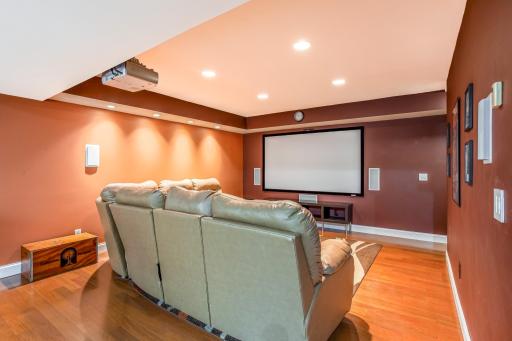 A dedicated home theatre creates the perfect setting for movie nights, complete with a projector, large screen, and built-in surround sound.