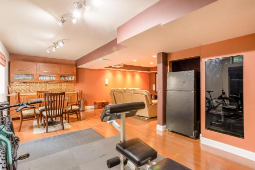 The lower level is thoughtfully designed with multiple spaces for recreation, relaxation, and everyday living.