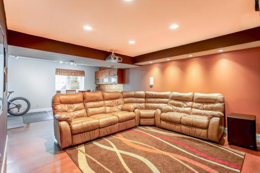 The spacious lower-level theatre offers a true cinematic atmosphere while flowing seamlessly into the adjoining recreation area.