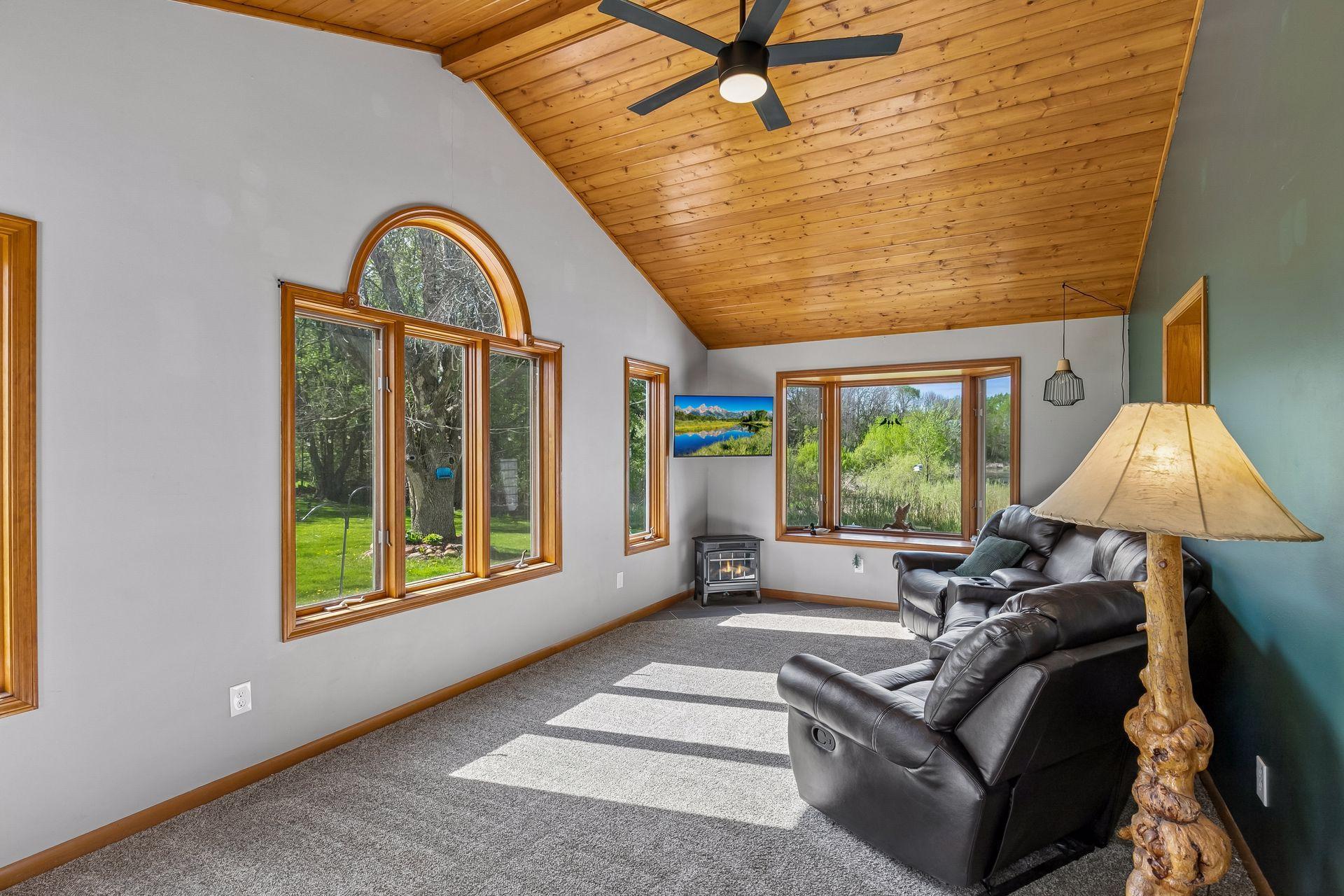 Family room/sun room features vaulted ceilings & awesome west views of the backyard.