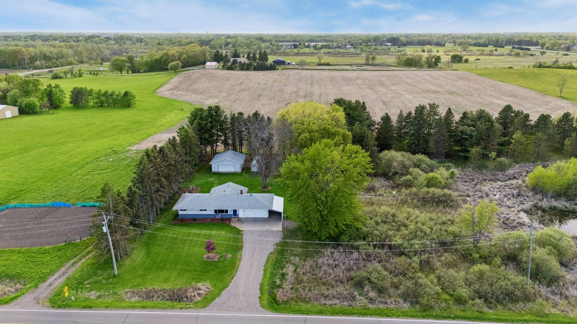 Experience peaceful country living just minutes from the Twin Cities! Nestled on 4.5 scenic acres in desirable Hugo, this charming rambler offers the perfect blend of privacy, space, & convenience.