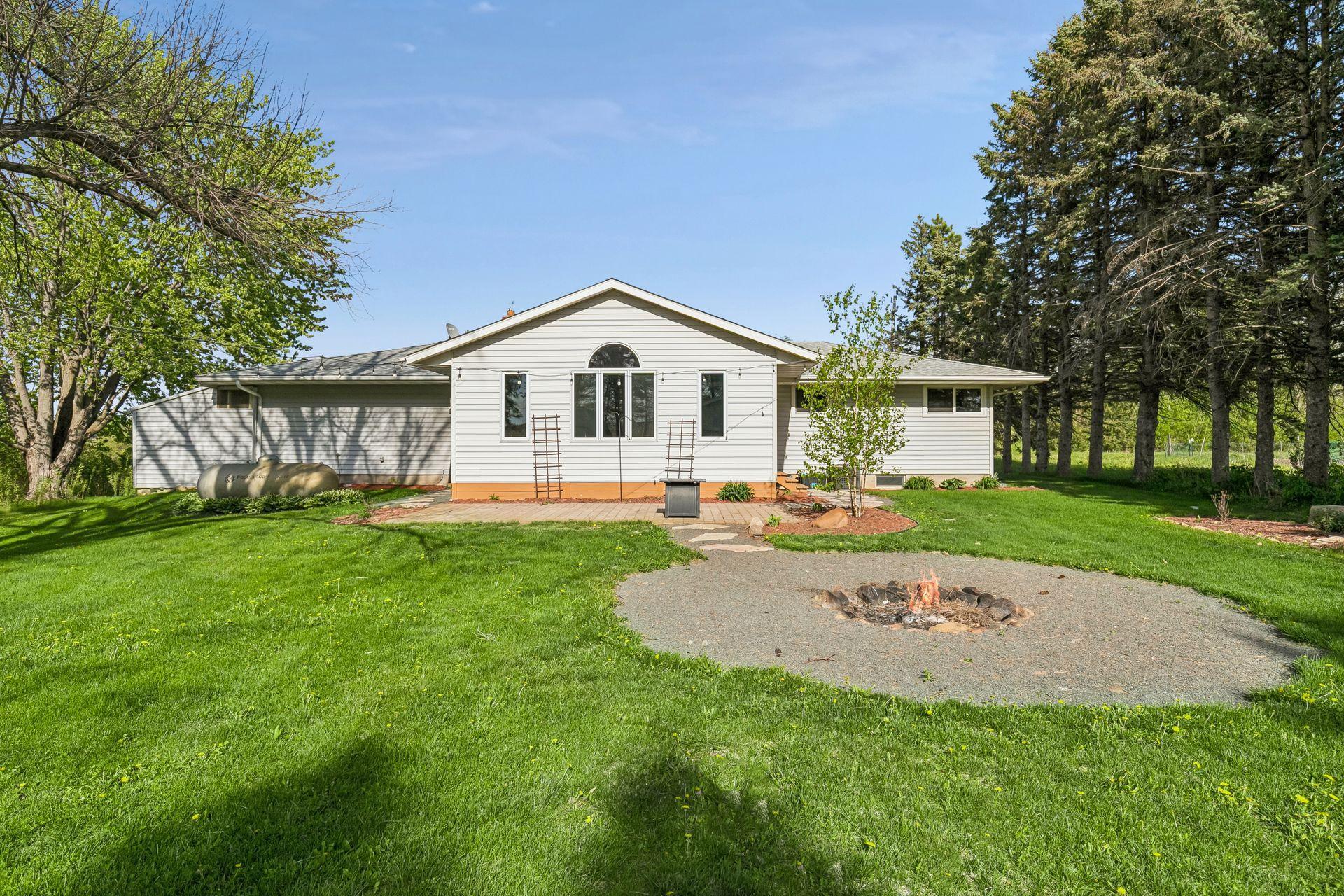 Take in the beautiful western light on the backyard patio. Cozy up around the fire pit on those cool nights.
