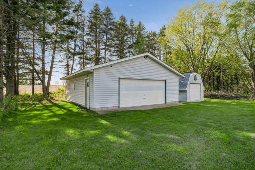 Sizable detached garage has concrete floor & tons of extra storage space for toys, boats, ATV's, etc.