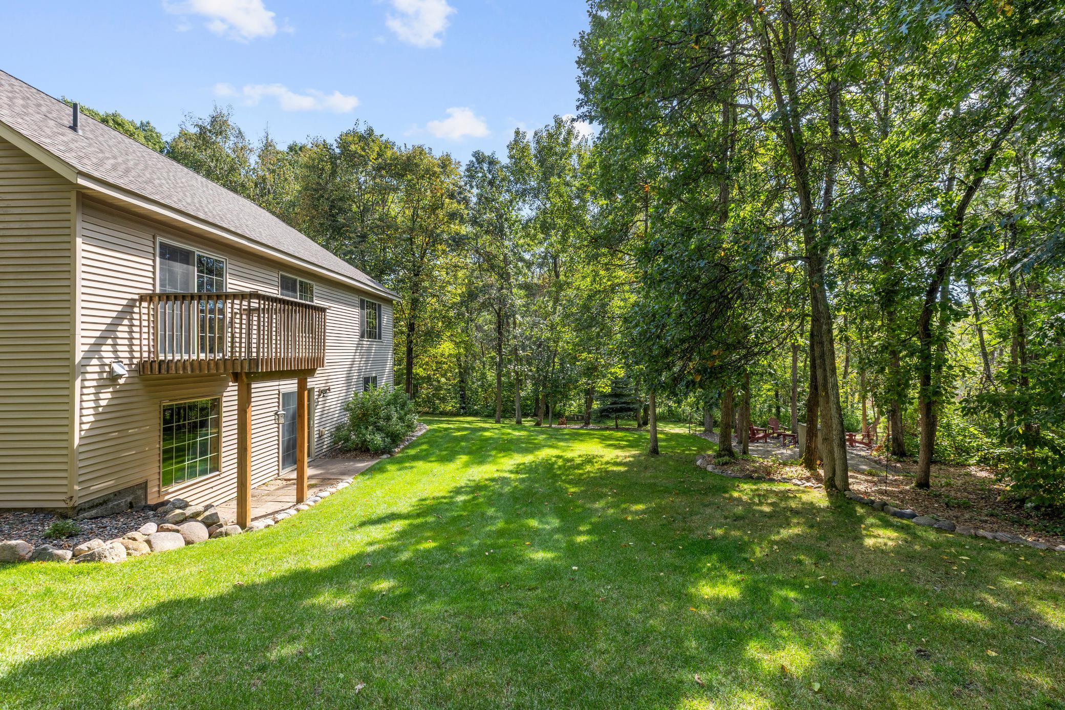 Backyard and newly stained private deck off of primary bedroom.