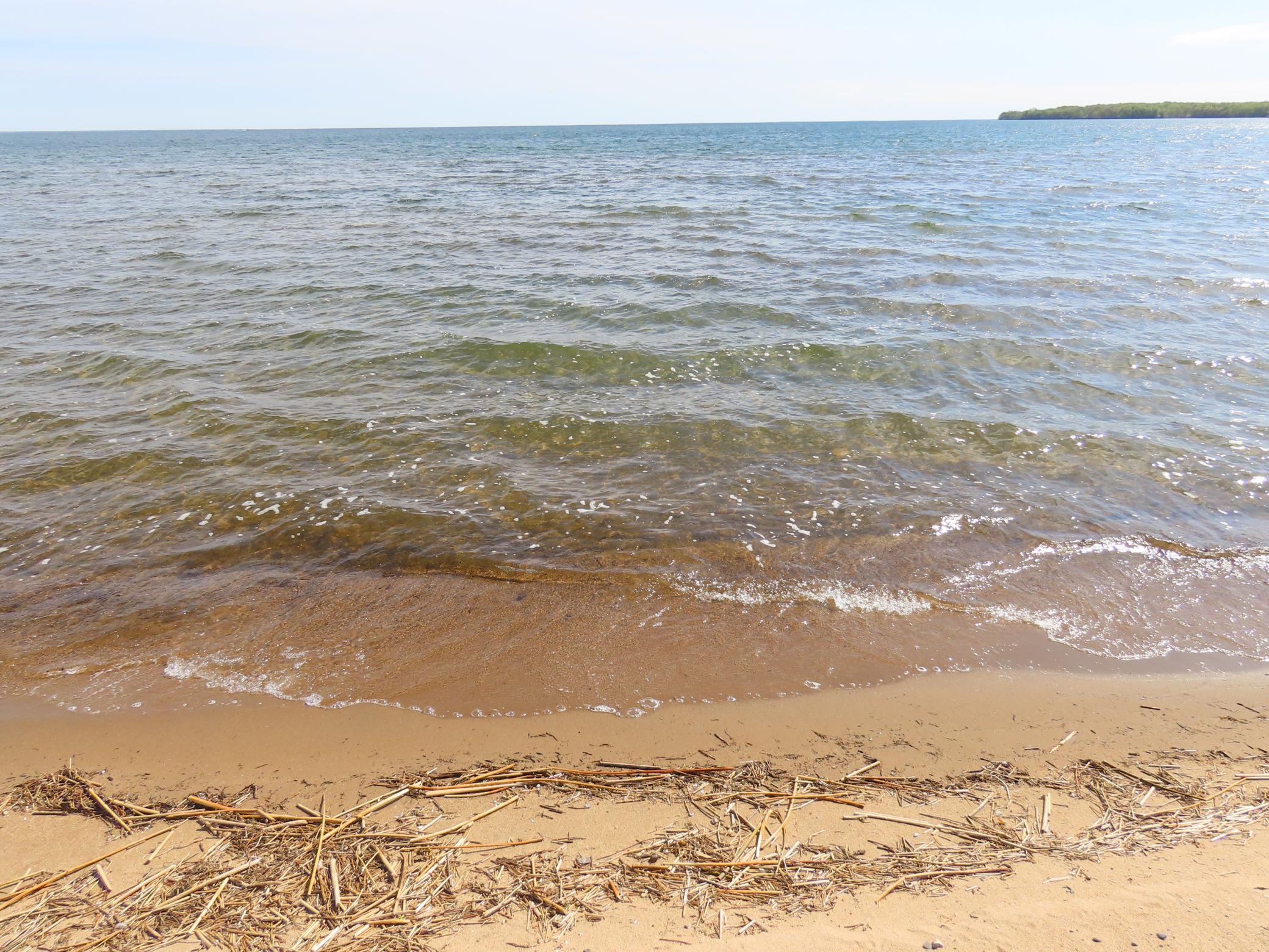Sandy swim beach across the road