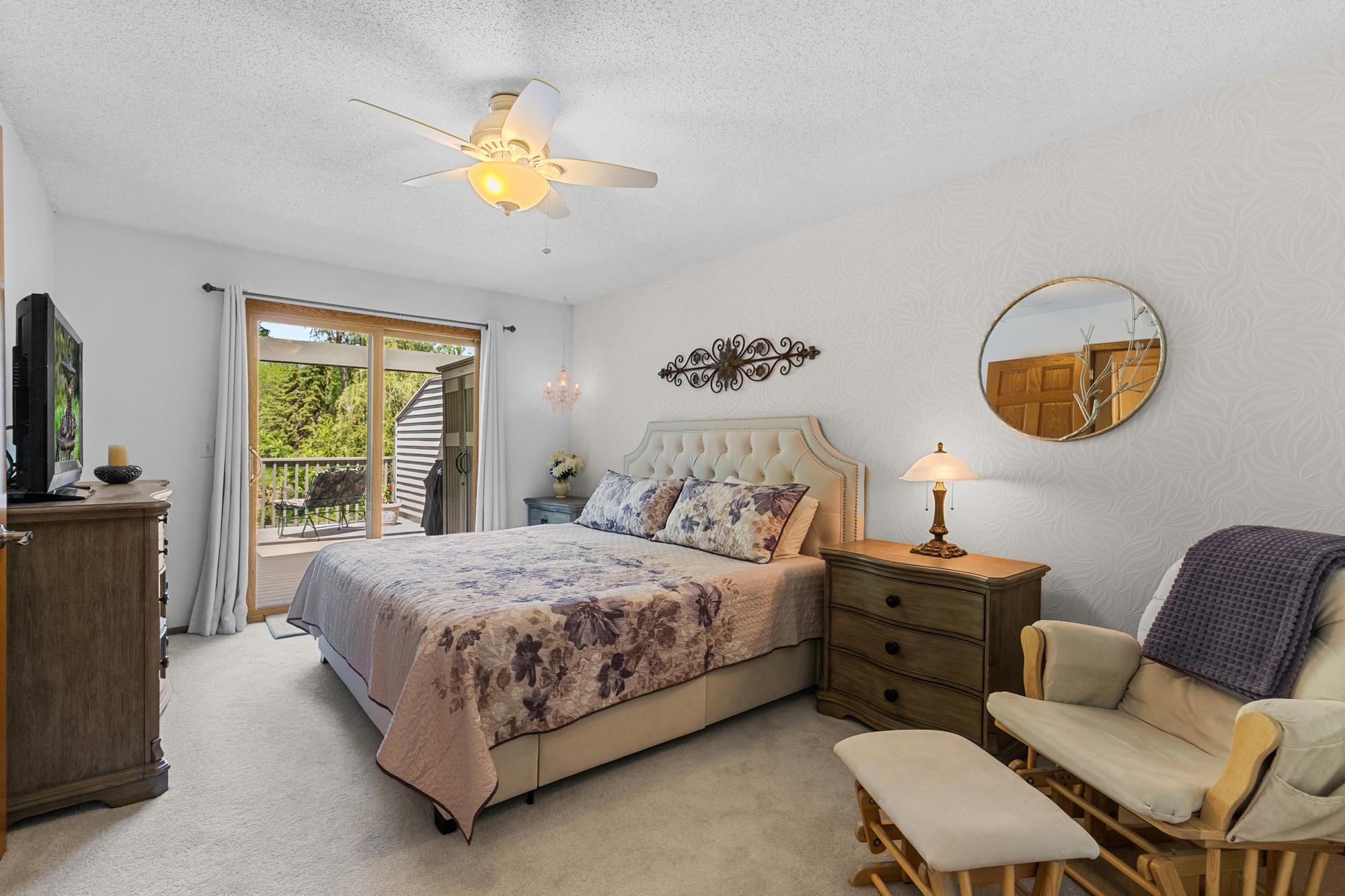 Main Level Primary Bedroom. Spacious and bright - an owner's ideal retreat for relaxation and rejuvenation.