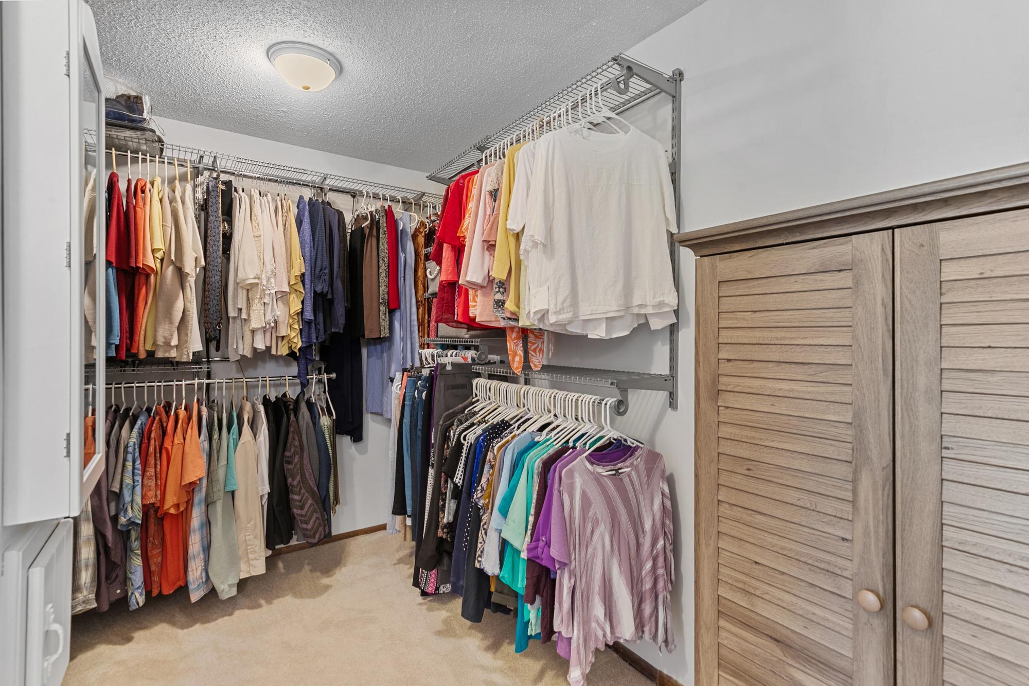 Generous primary closet, with additional w/d hook-up and laundry chute.