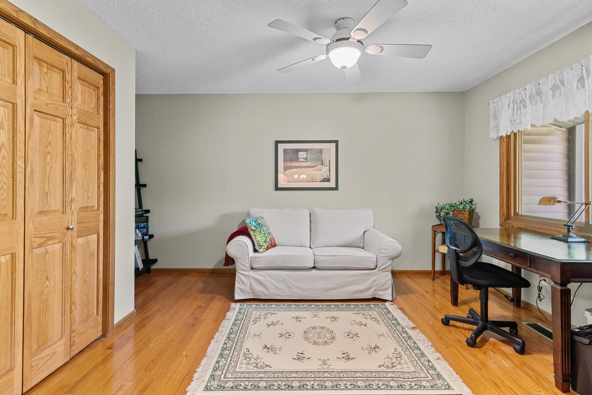 Main level second bedroom / den / office. The gleaming hardwood floors stretch through the majority of the main level.