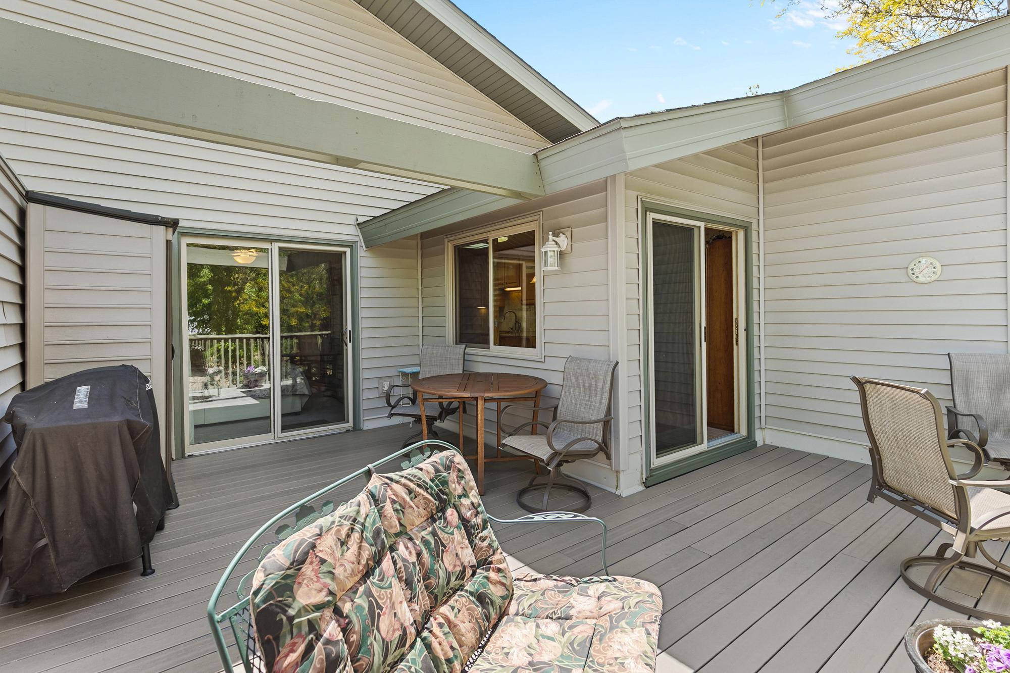 Deck entries from dining space and primary bedroom.