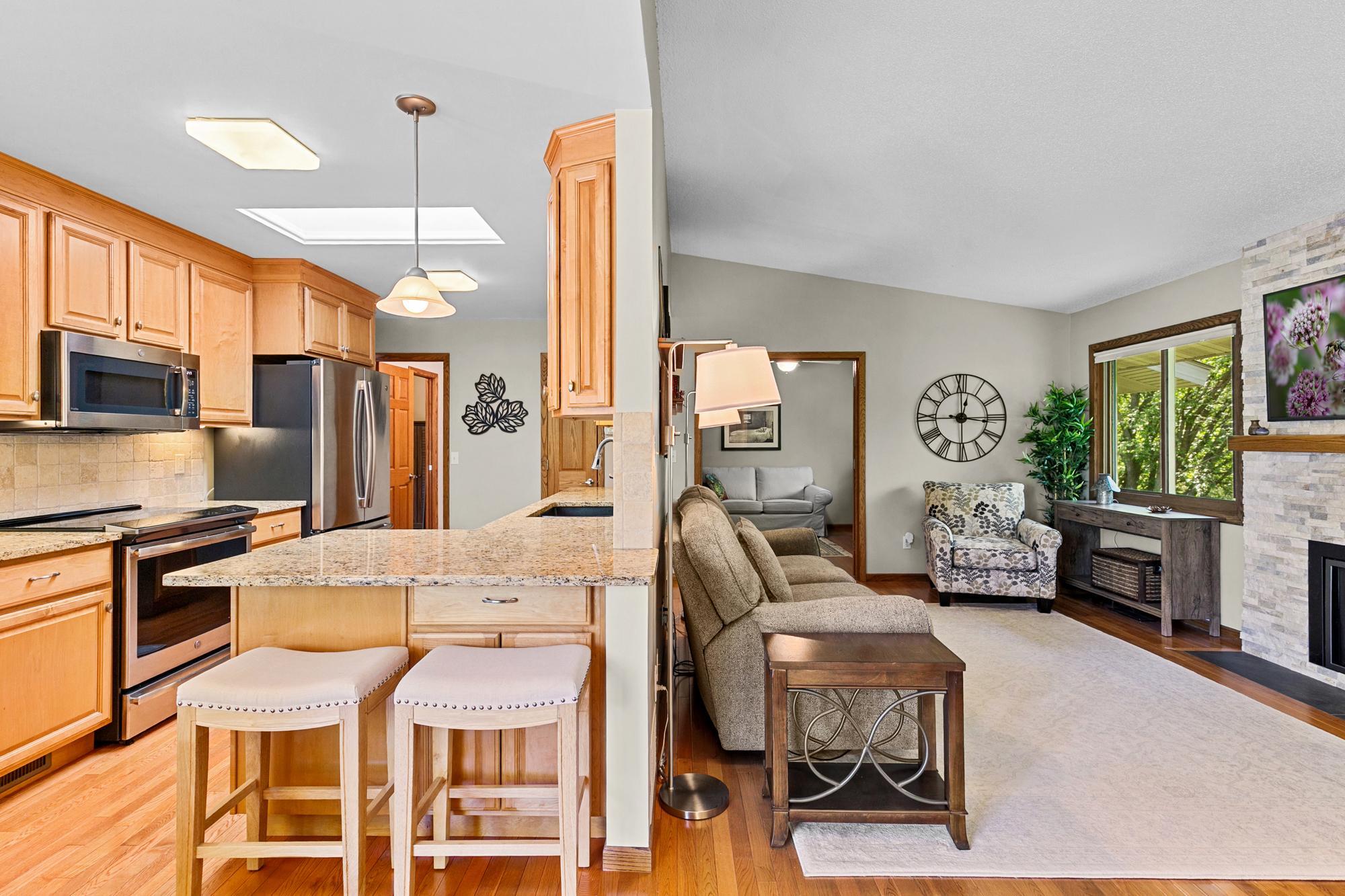 Steps away from the main level family room the gourmet kitchen demands recognition - from the updated custom cabinetry, granite countertops, GE profile appliances inclusive of induction stove top and convection oven and microwave and microwave.