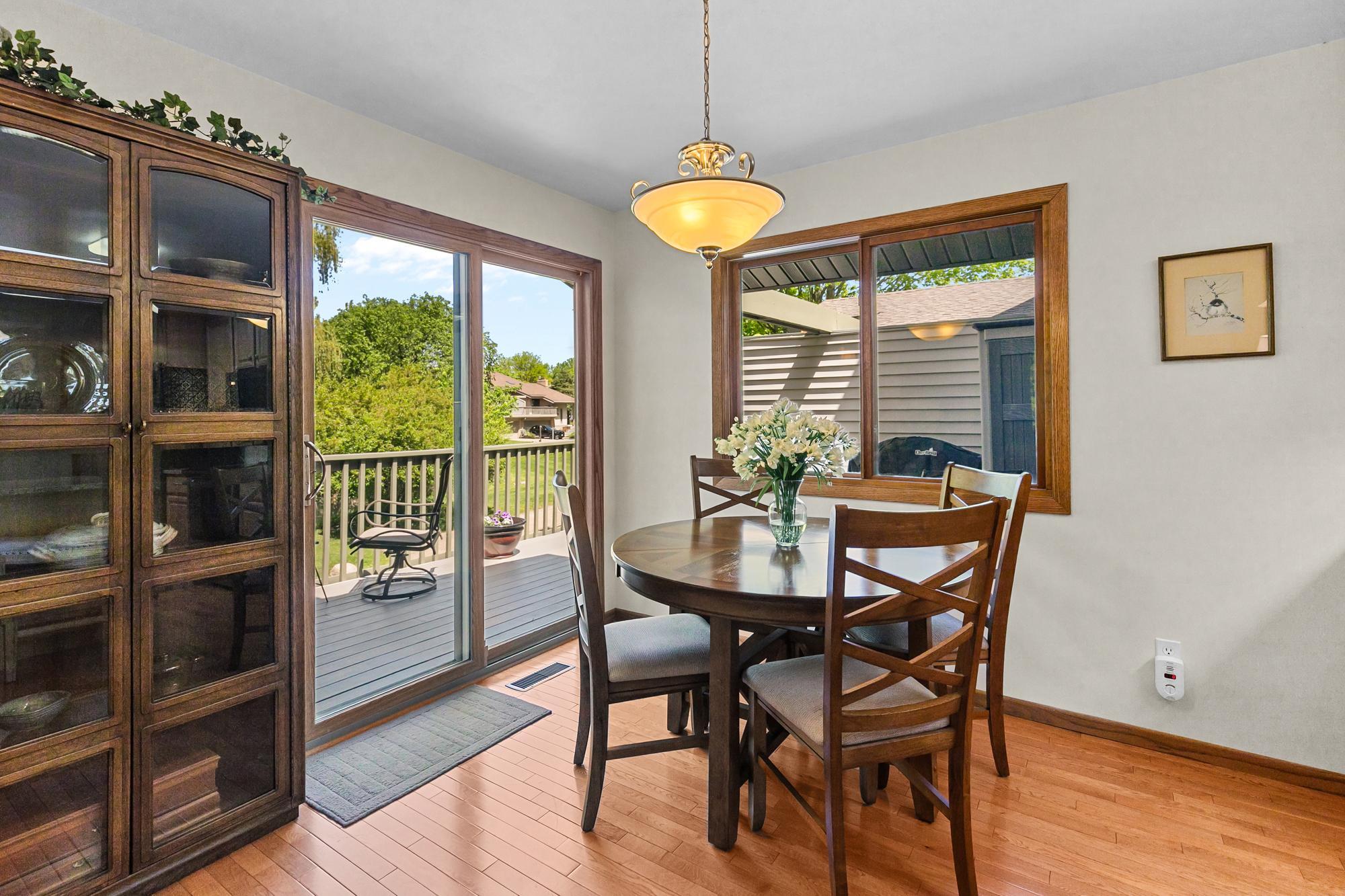 Main level dining space providing easy access to the unit's large deck / exterior living space.