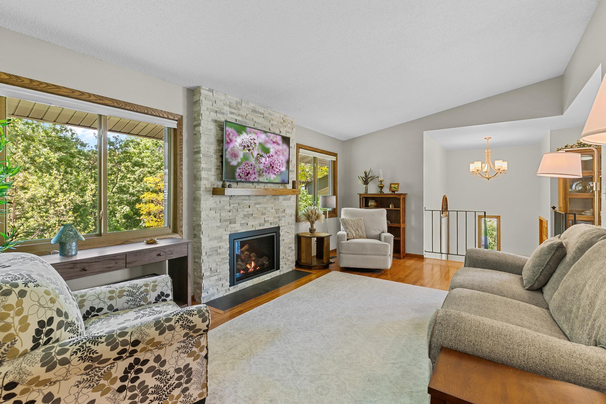 Main Level Family Room - complete with designer stone surround gas fireplace.