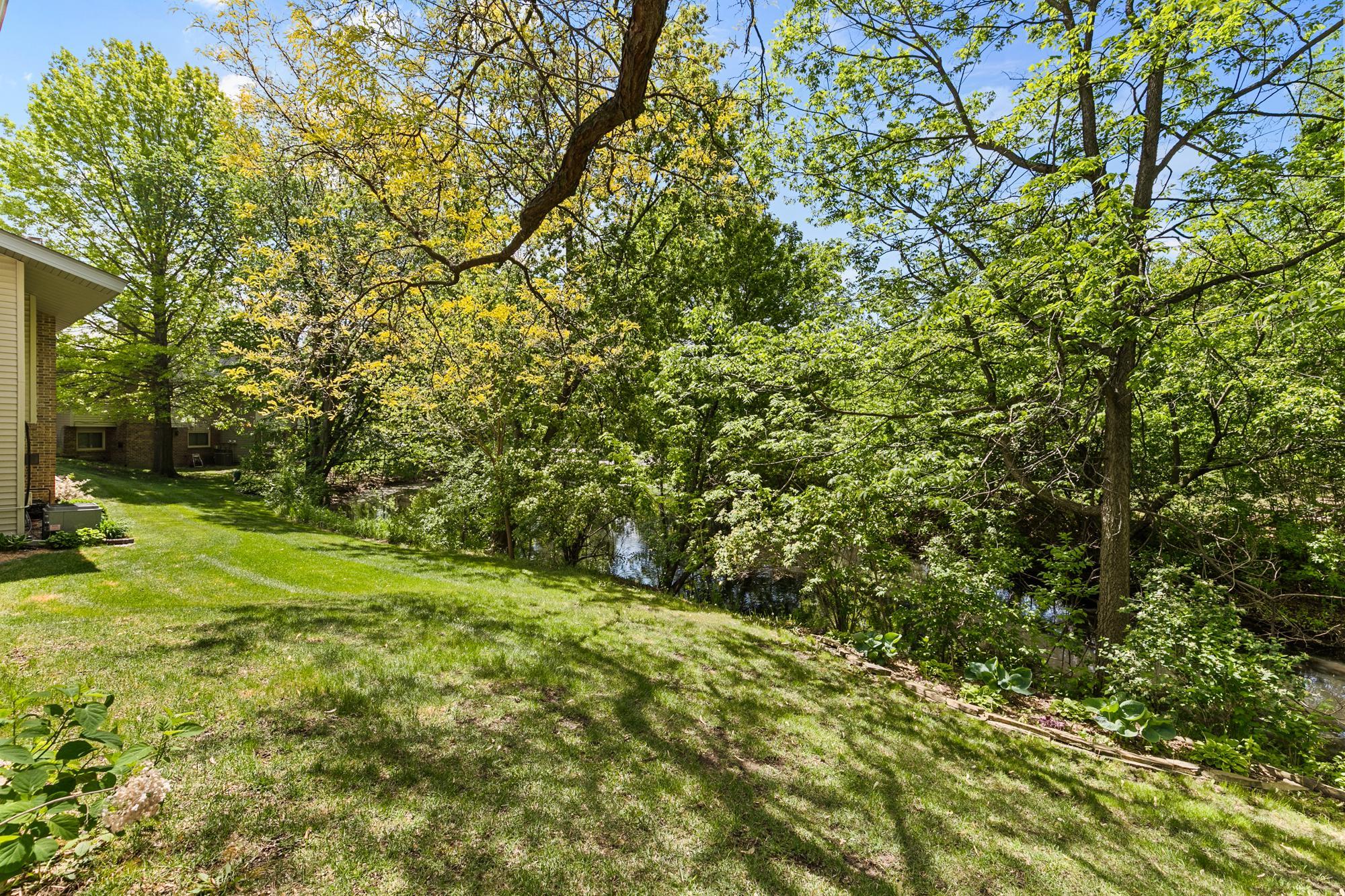 Imagine waking to this view on a daily basis. Watch nature take it's course from the confines of your updated townhome or your serene outdoor spaces.