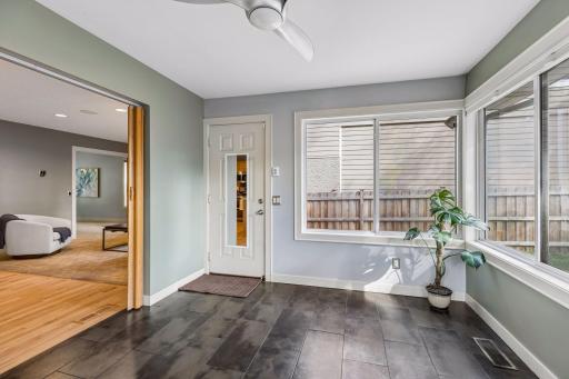 The sun room walks out to the patio and backyard.