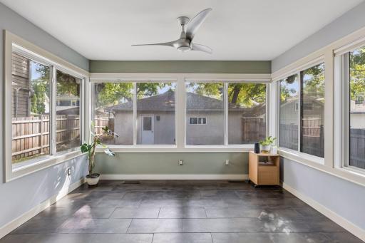 South facing sun room with walls of windows! Fantastic flex space for an office, play room, den...