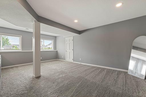 Huge, L-shaped family room was built in 2021. Storage closet behind