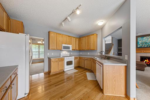 Kitchen also has hardwood floors. Formal dining connected at front.