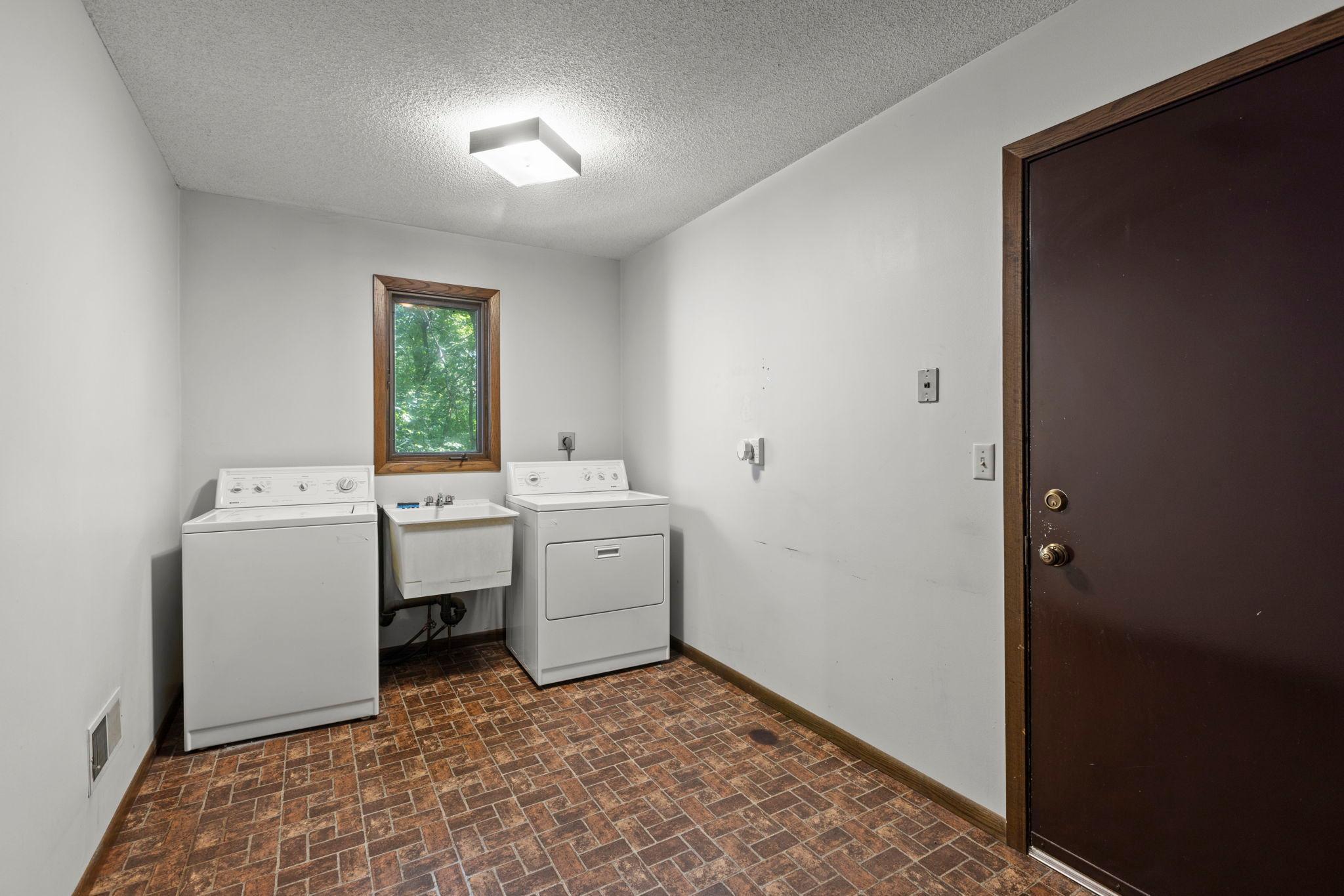 Main floor laundry with garage entry 1.jpg
