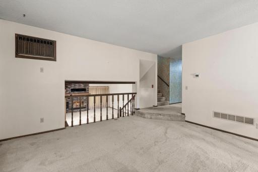 Main level living room with lower level family room perspective.jpg