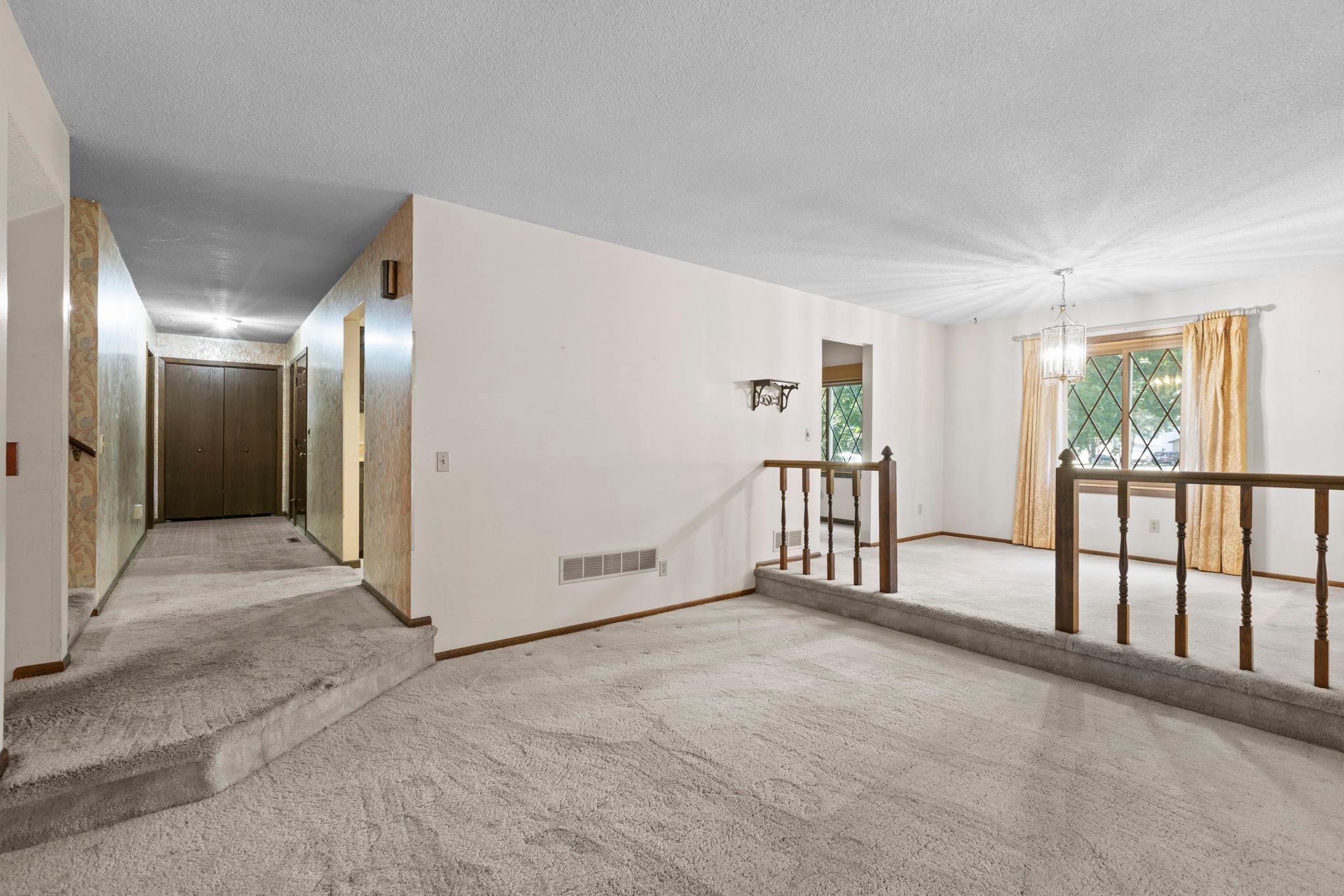 Main level living room with entry foyer pespective.jpg