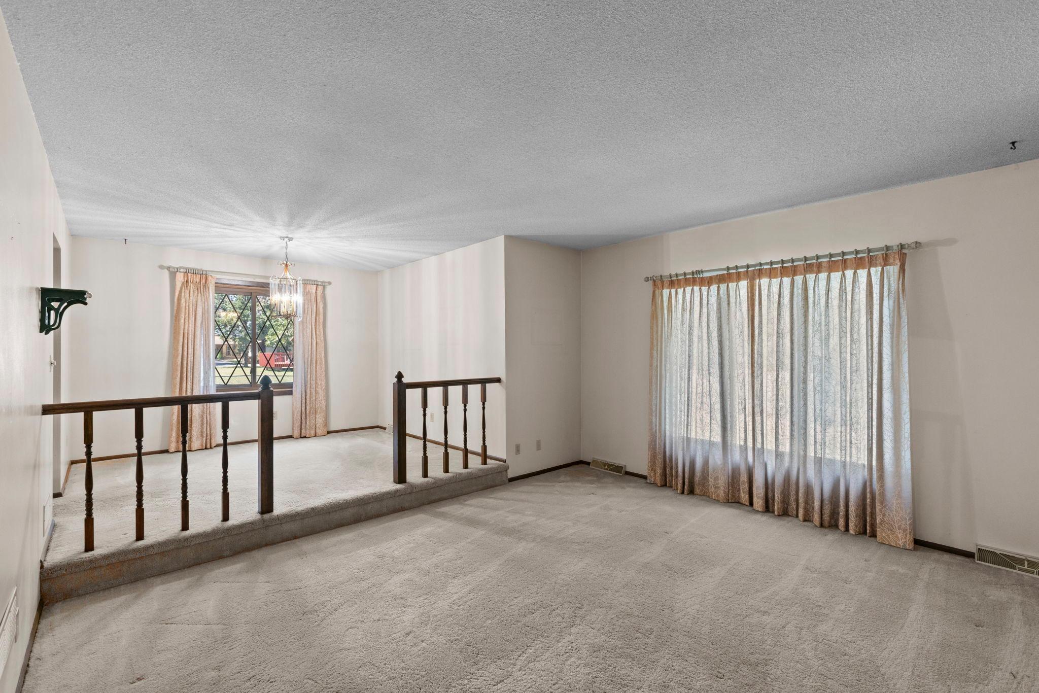 Main level living room with dining area perspective.jpg