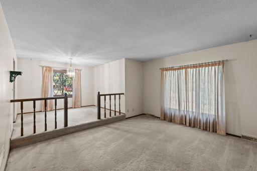 Main level living room with dining area perspective.jpg
