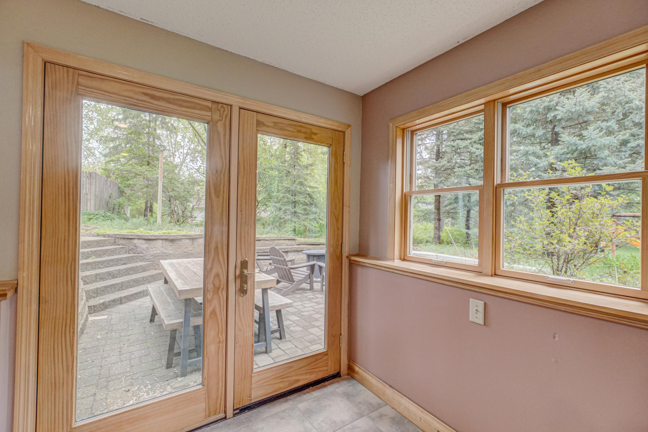 Walk out to the spacious stone patio and firepit.