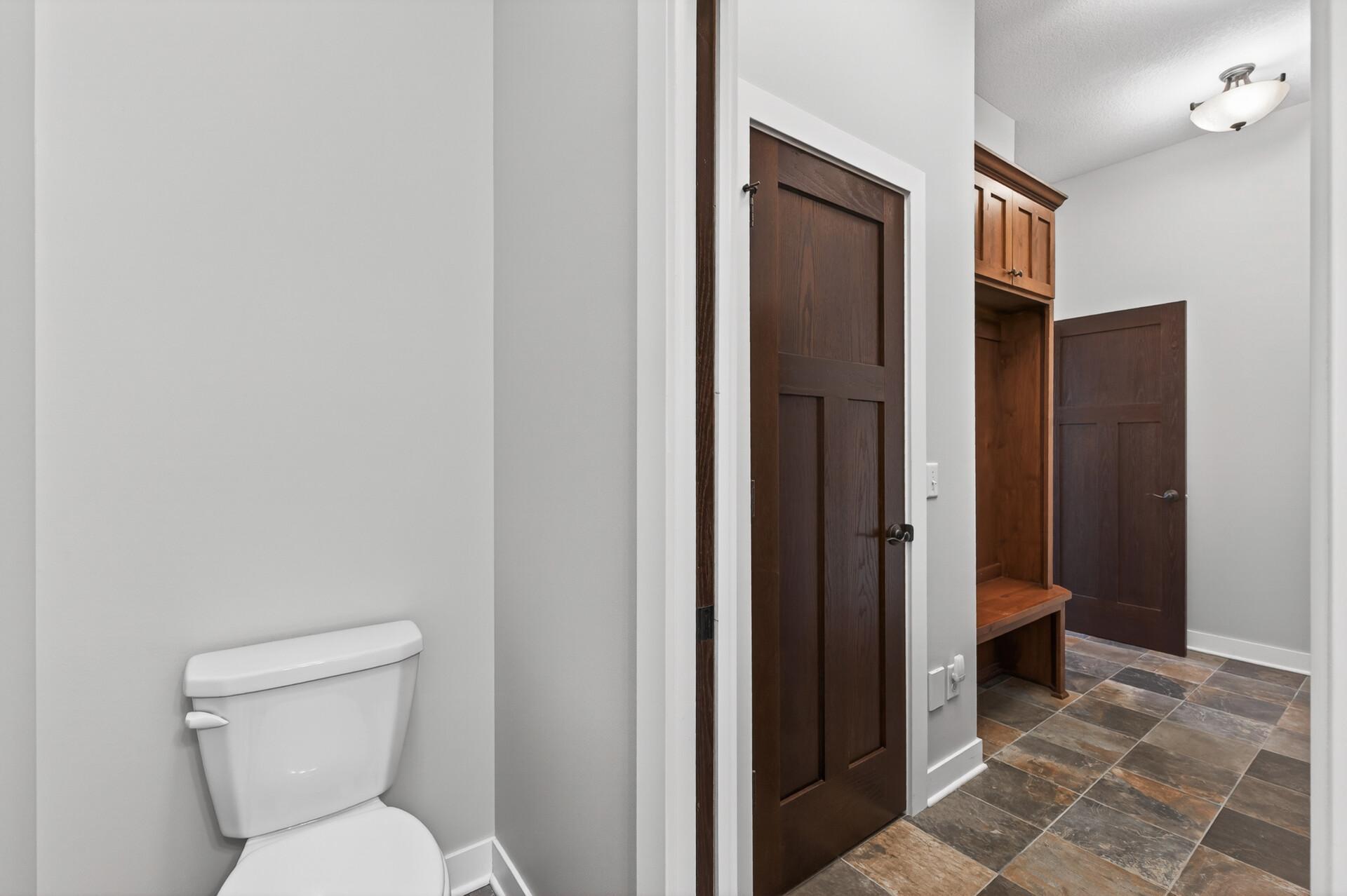 Slate floors and a pocket door provide exceptional ease of use and maintenance.
