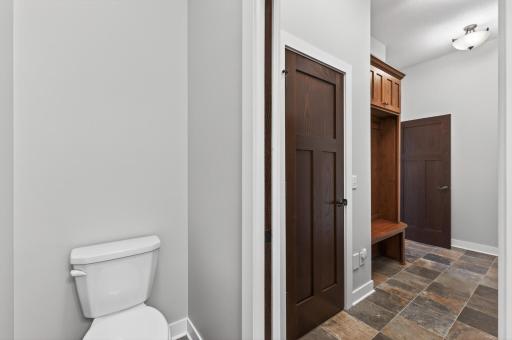 Slate floors and a pocket door provide exceptional ease of use and maintenance.