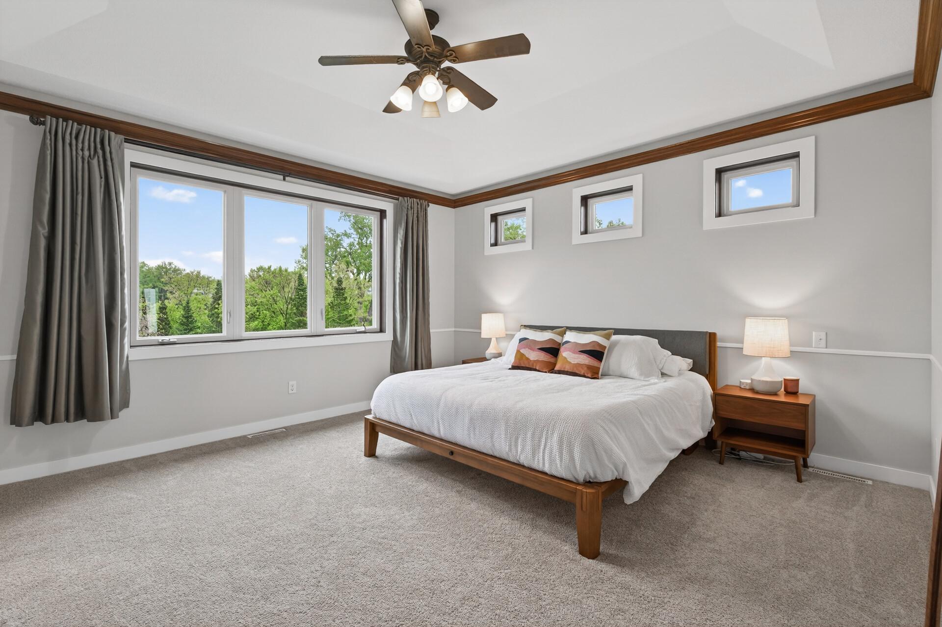 The massive primary bedroom provides a true serene experience.