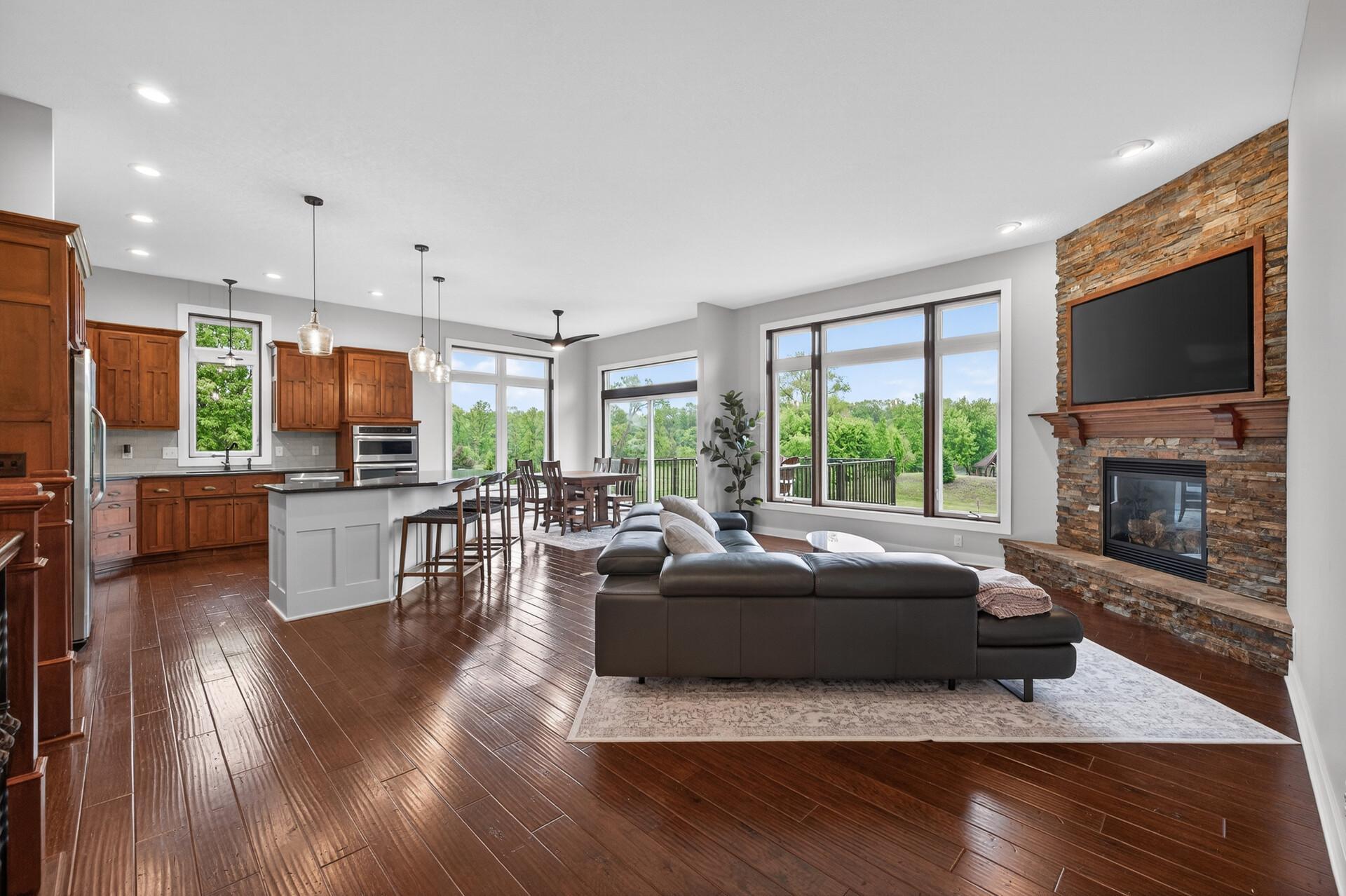 Entertain with ease in the open kitchen/dining/living area with an attached maintenance free deck. All overlooking the gorgeous backyard and Mississippi River.