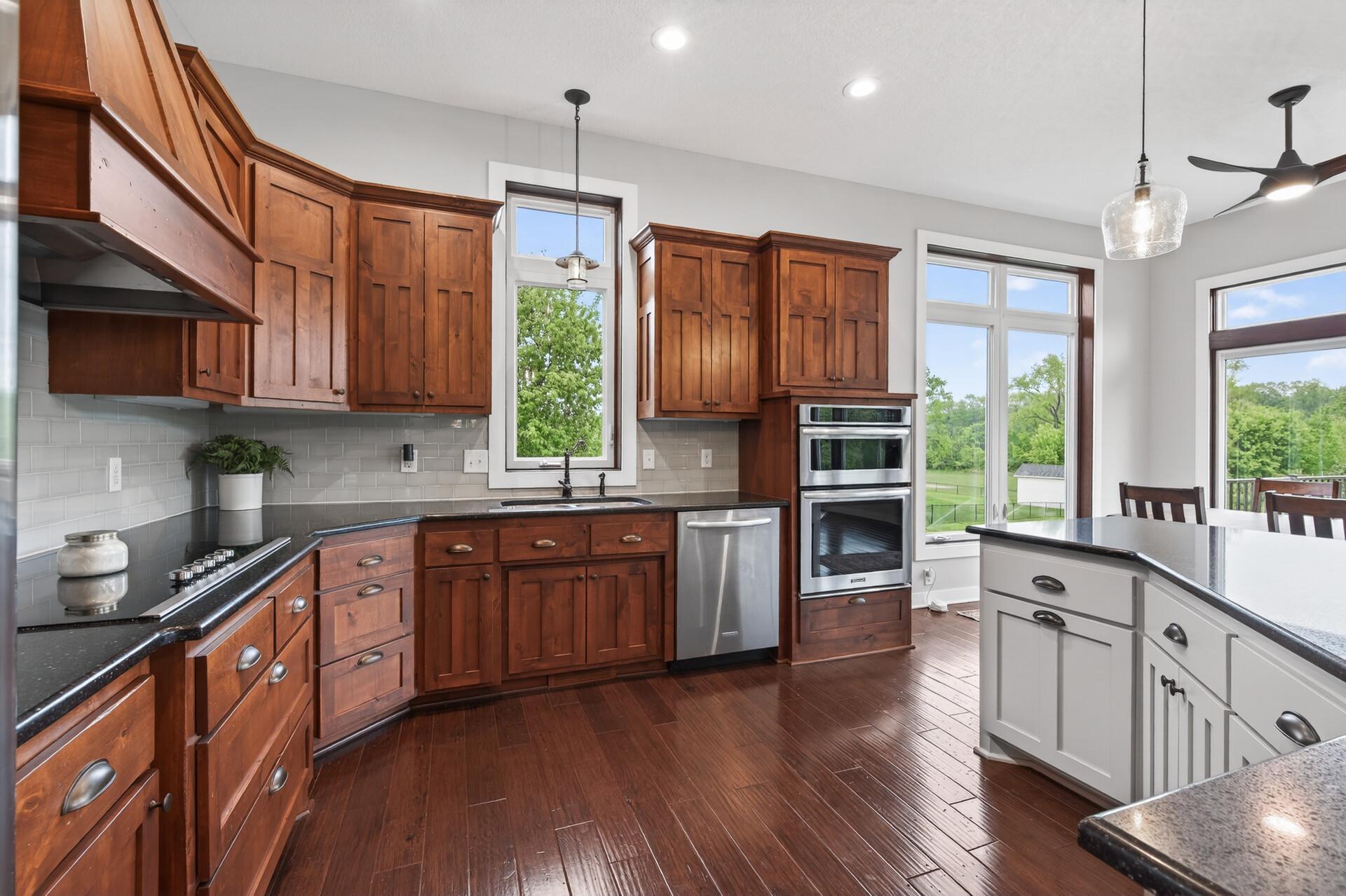 Hardwood floors complement the custom millwork.