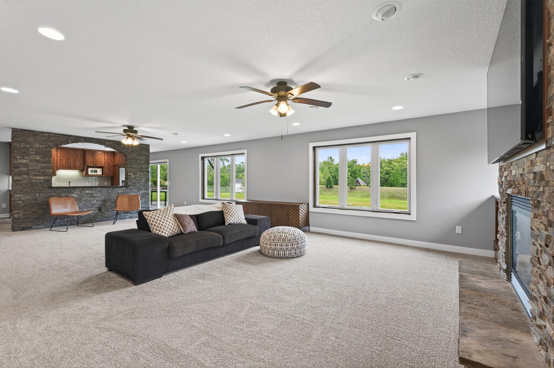 The walk-out features the same oversized windows to maximize the views.