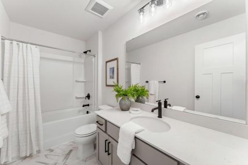 Thoughtfully designed and perfectly placed just steps from each of the secondary upper level bedrooms, this spacious and stylish upper level full bathroom offers many of todays desired amenities.