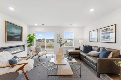 Family room walks out to patio overlooking backyard. Looking for a bit of privacy..? All functioning windows throughout the home come with blinds (excluding sliding glass patio door).