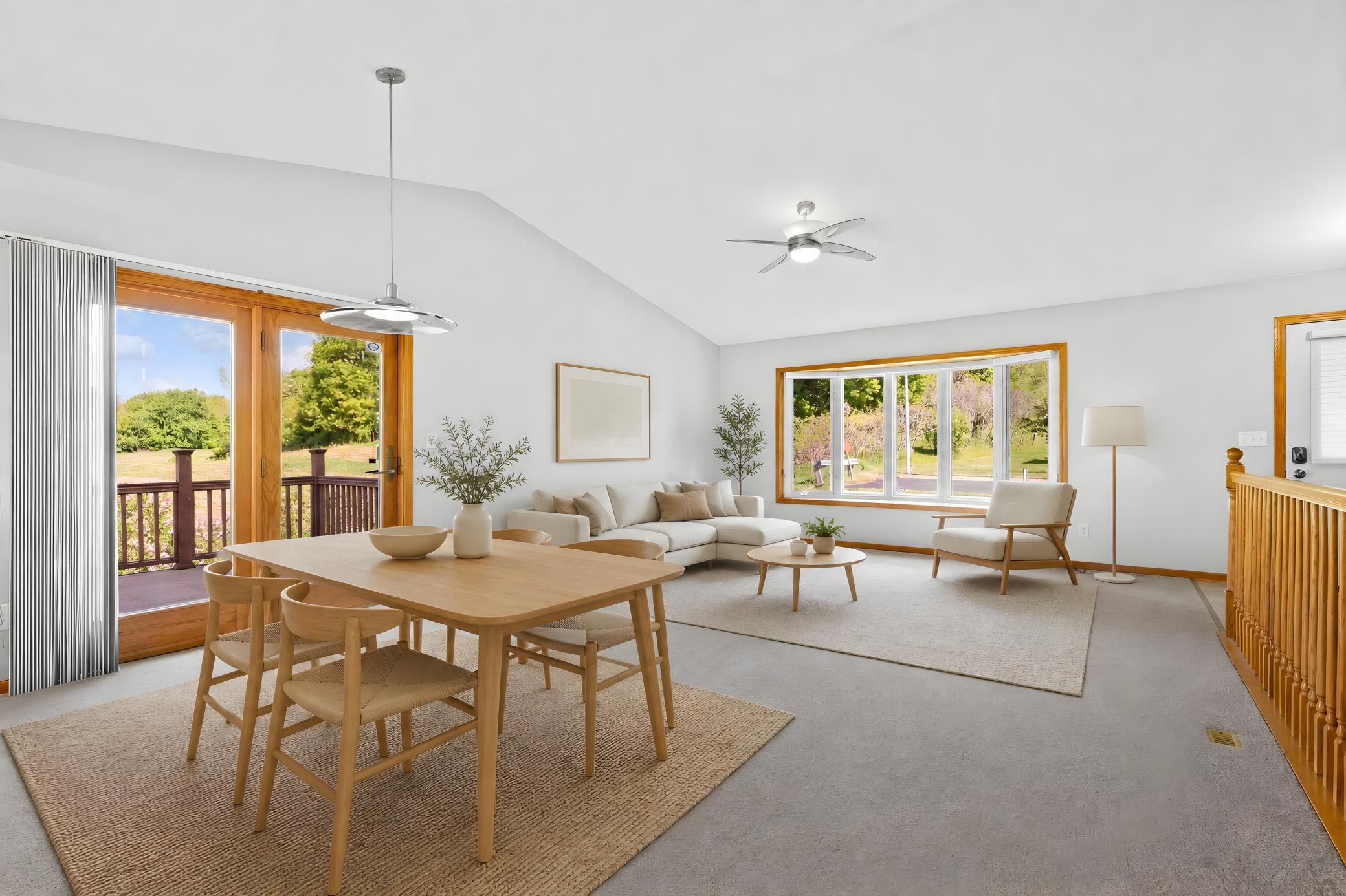 Virtually staged dining room looking into living room and deck #1 side yard view