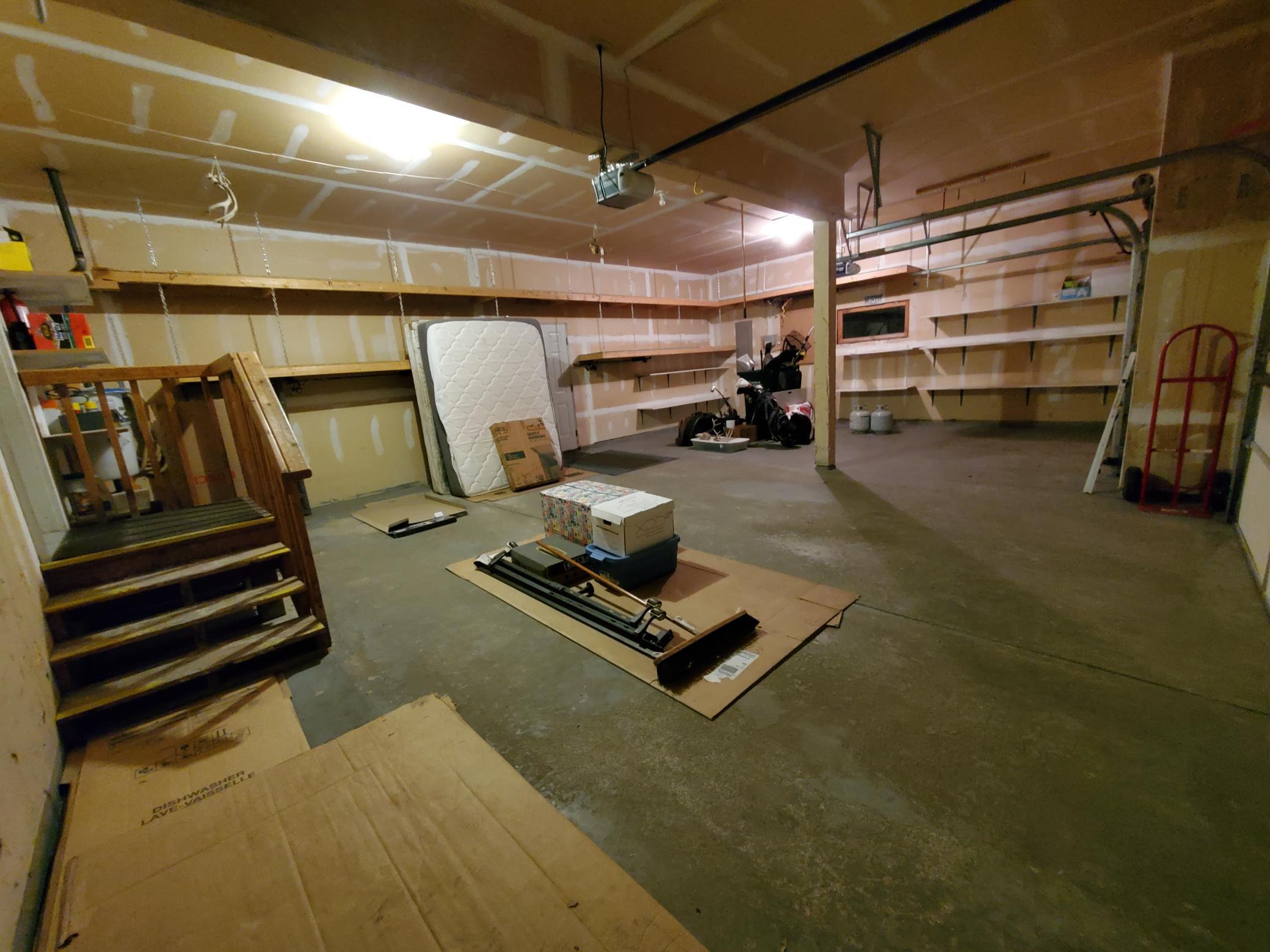 Insulated 3-car garage with tons of garage shelving.