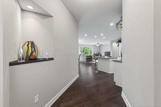 Rich hard surface flooring flows seamlessly into the homeâs open concept living area.