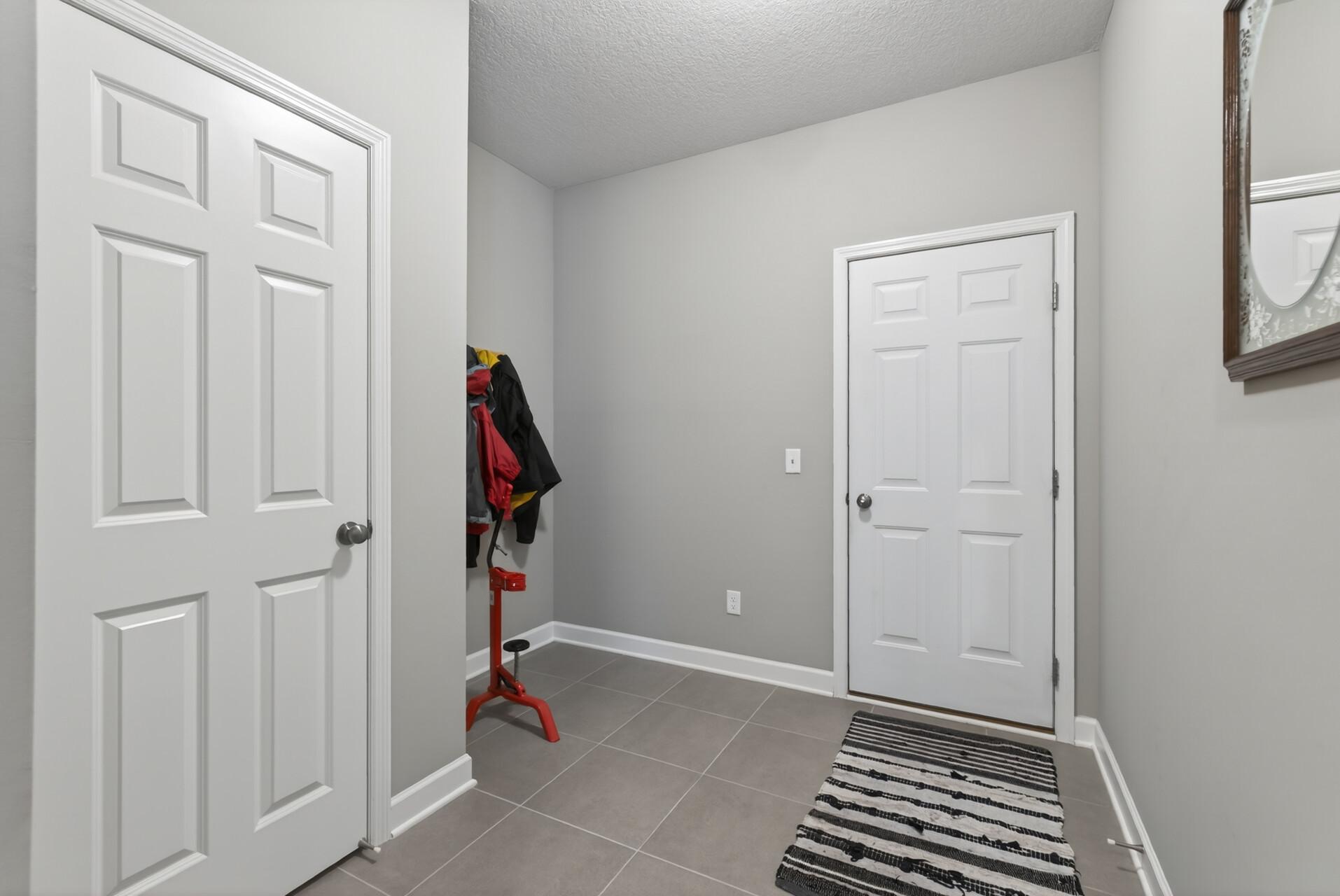 Secondary entrance from the attached 3 car garage.