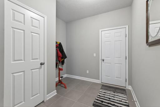 Secondary entrance from the attached 3 car garage.