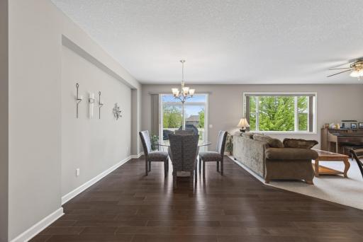 The informal dining area offers a walkout to the deck with stairs leading to the backyard for easy indoor-outdoor living.