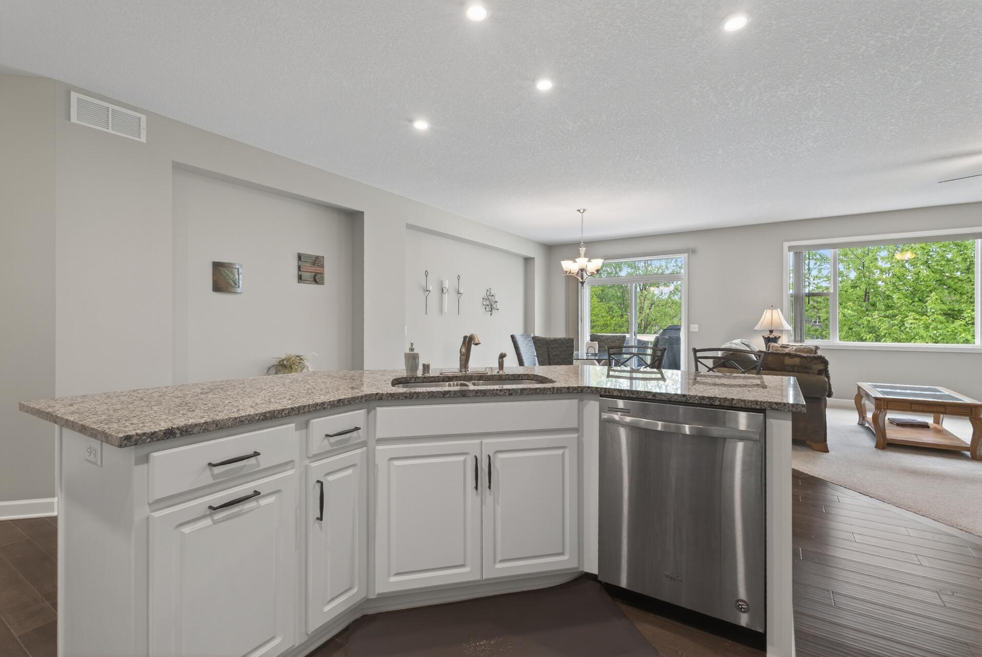 Enjoy sleek hard surface countertops paired with modern hardware for a clean, updated look.