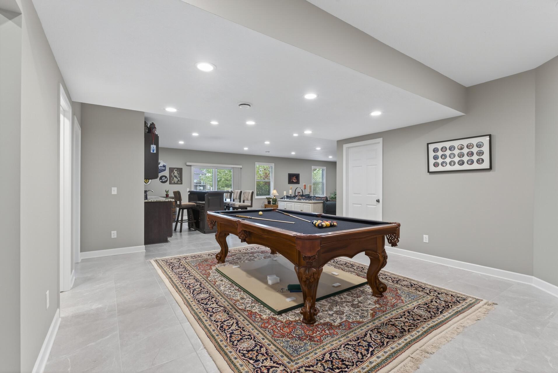 Downstairs, the walk-out lower level expands your living space with a spacious family room.