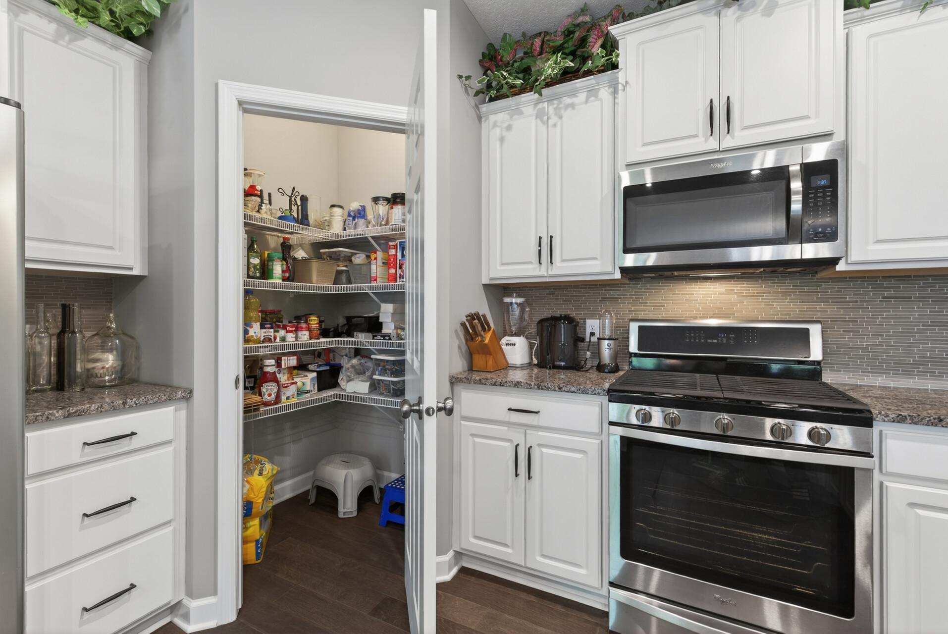 Convenient pantry with additional storage and organization.